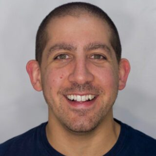 A headshot of Richie Aharonian, Unito's Head of Customer Support